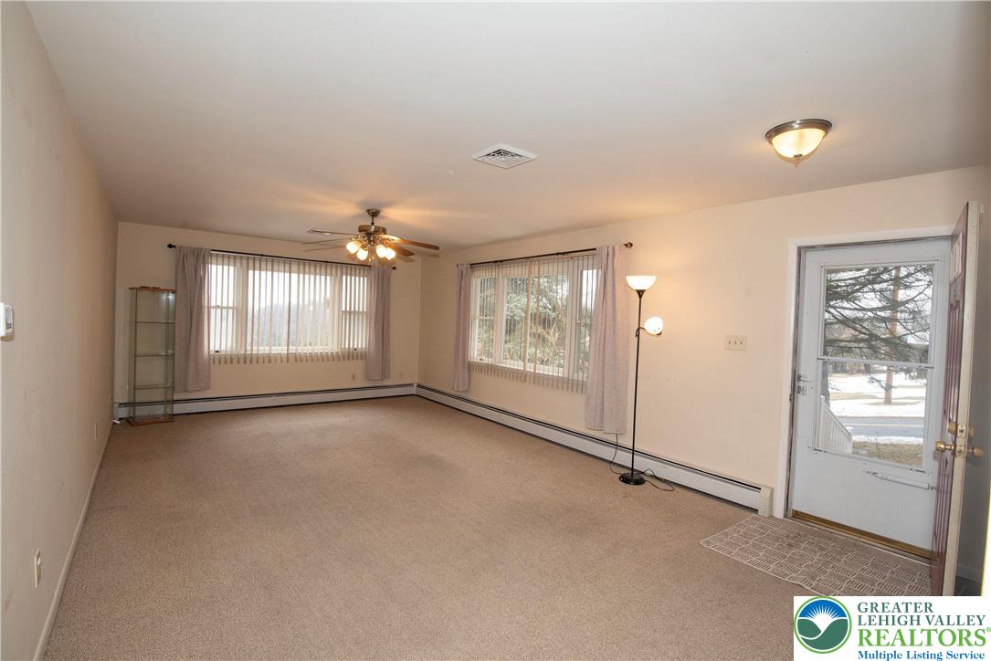 844 Weil Street Bethlehem, PA 18015 - Photo 4 of 19 an empty room with windows and closet