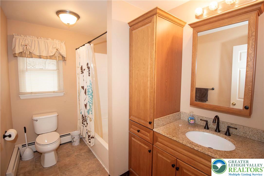 844 Weil Street Bethlehem, PA 18015 - Photo 9 of 19 a bathroom with a granite countertop sink toilet and shower