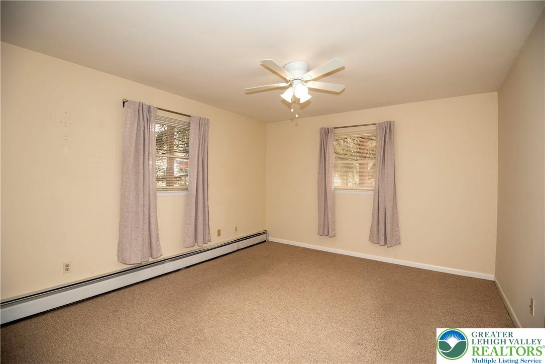 844 Weil Street Bethlehem, PA 18015 - Photo 10 of 19 an empty room with windows and fan