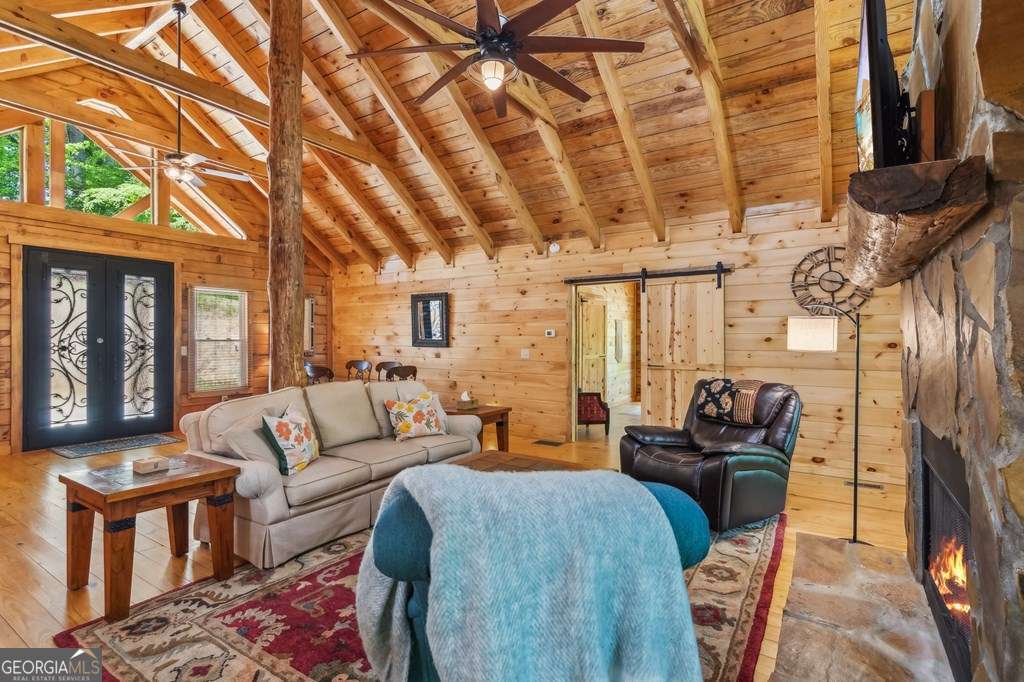 245 Timberwalk Drive, Unit 16 Ellijay, GA 30540 - Photo 13 of 56 a living room with furniture