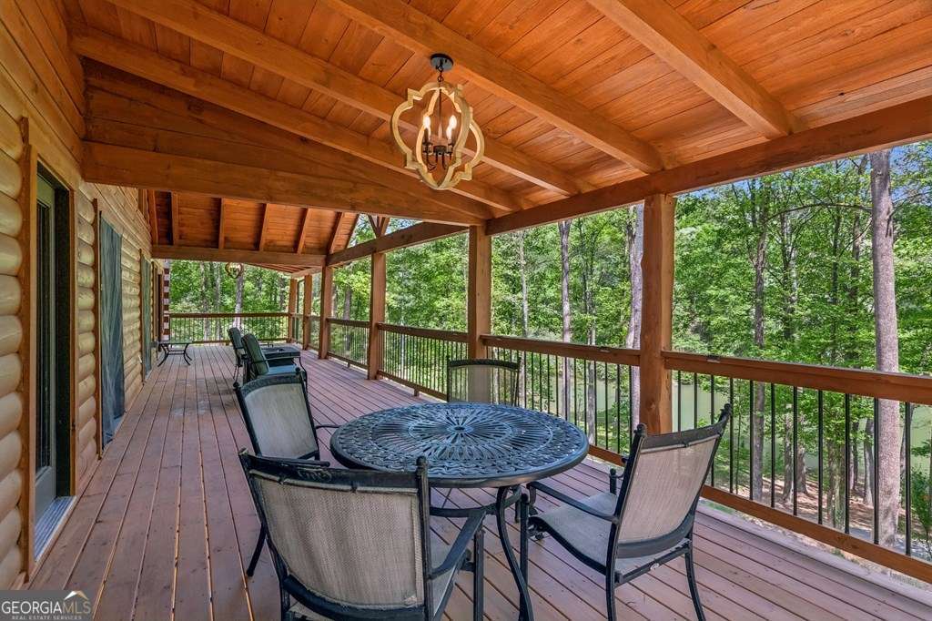 245 Timberwalk Drive, Unit 16 Ellijay, GA 30540 - Photo 19 of 56 a view of porch with a table and a chairs