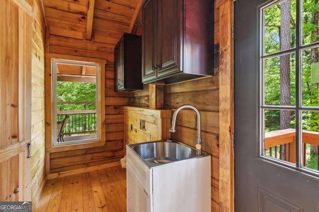 245 Timberwalk Drive, Unit 16 Ellijay, GA 30540 - Photo 30 of 56 a kitchen with a sink a refrigerator and window