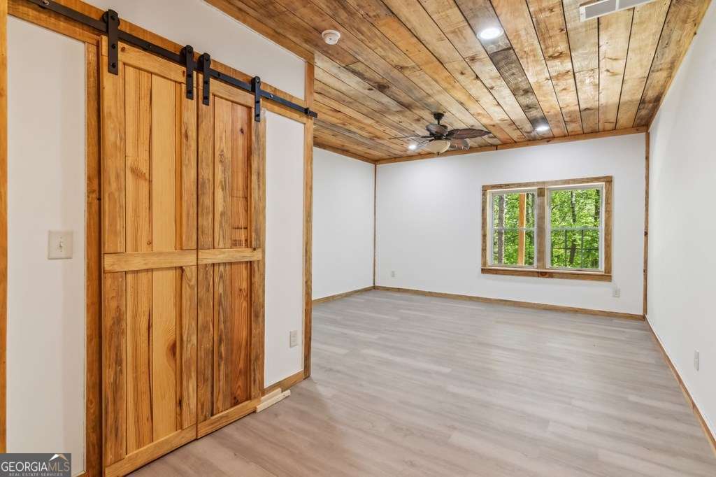 245 Timberwalk Drive, Unit 16 Ellijay, GA 30540 - Photo 35 of 56 a view of entryway with wooden walls
