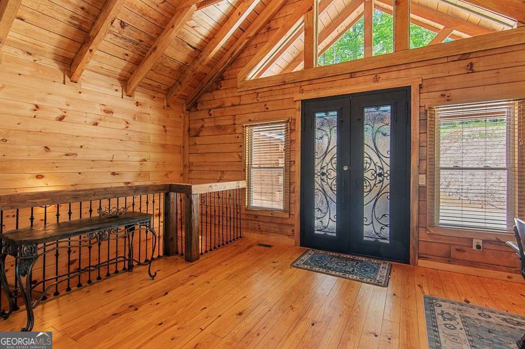 245 Timberwalk Drive, Unit 16 Ellijay, GA 30540 - Photo 7 of 56 a view of a wooden house with a large window