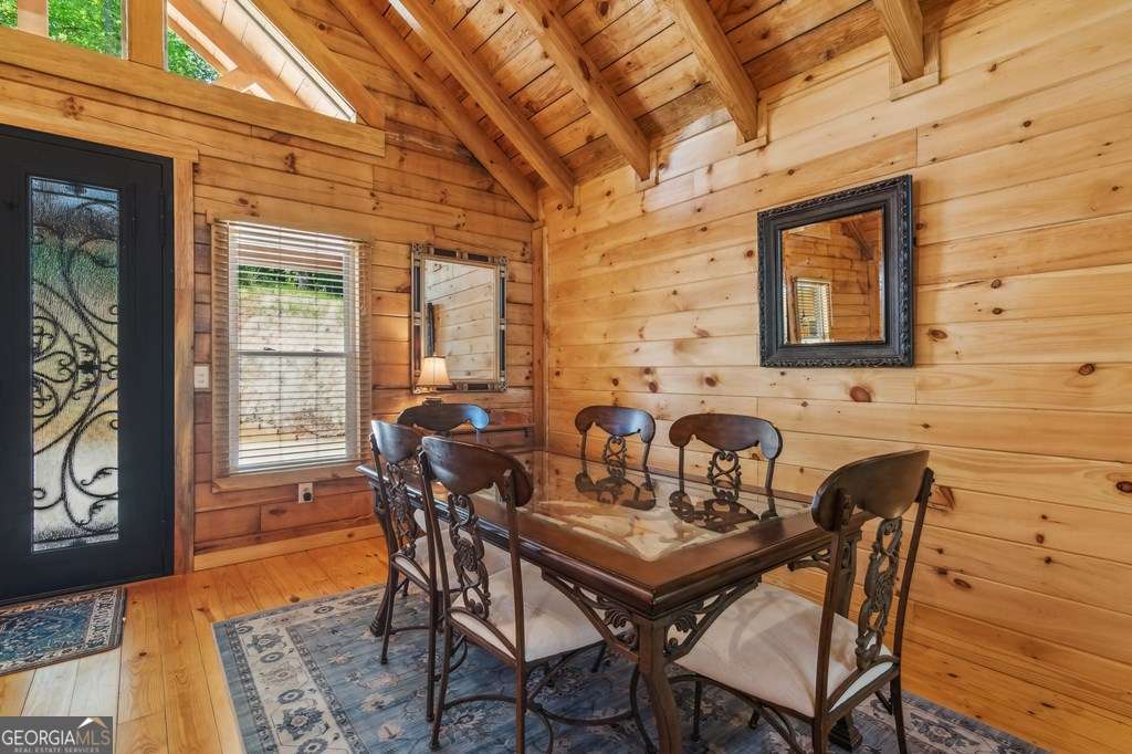 245 Timberwalk Drive, Unit 16 Ellijay, GA 30540 - Photo 9 of 56 a view of a dining room with furniture window and outside view