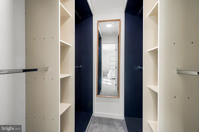 a bathroom with a double vanity sink toilet and shower