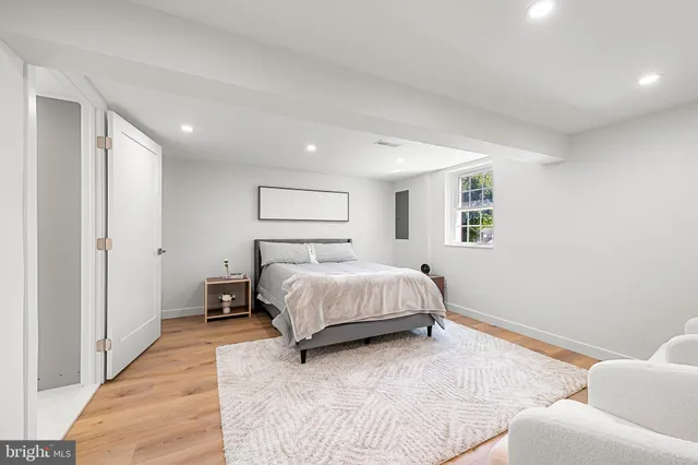 a spacious bedroom with a bed and a couch