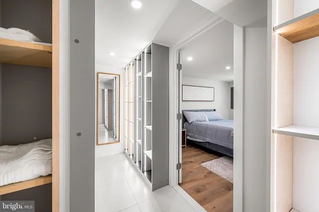 a view of a room with wooden floor and furniture