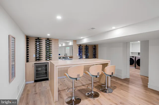a utility room with sink dryer and washer