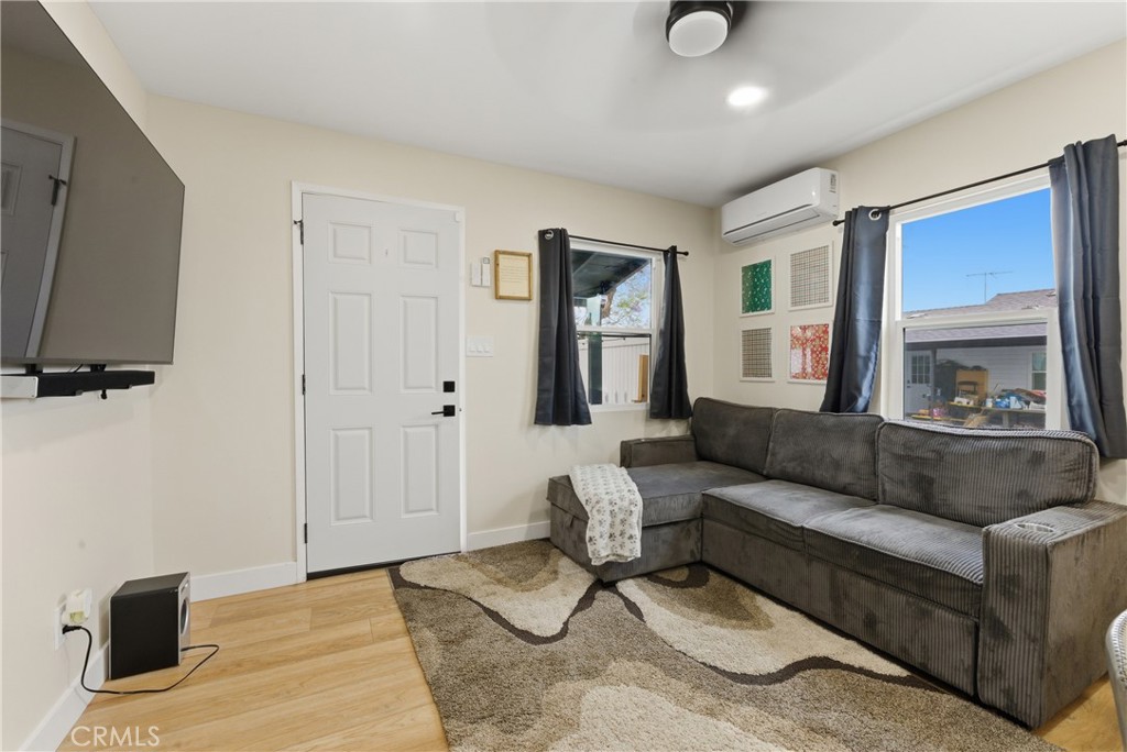 14335 Leffingwell Road Whittier, CA 90604 - Photo 12 of 42 a living room with furniture and a flat screen tv