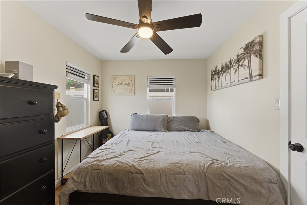 14335 Leffingwell Road Whittier, CA 90604 - Photo 19 of 42 a bedroom with a bed and a chandelier