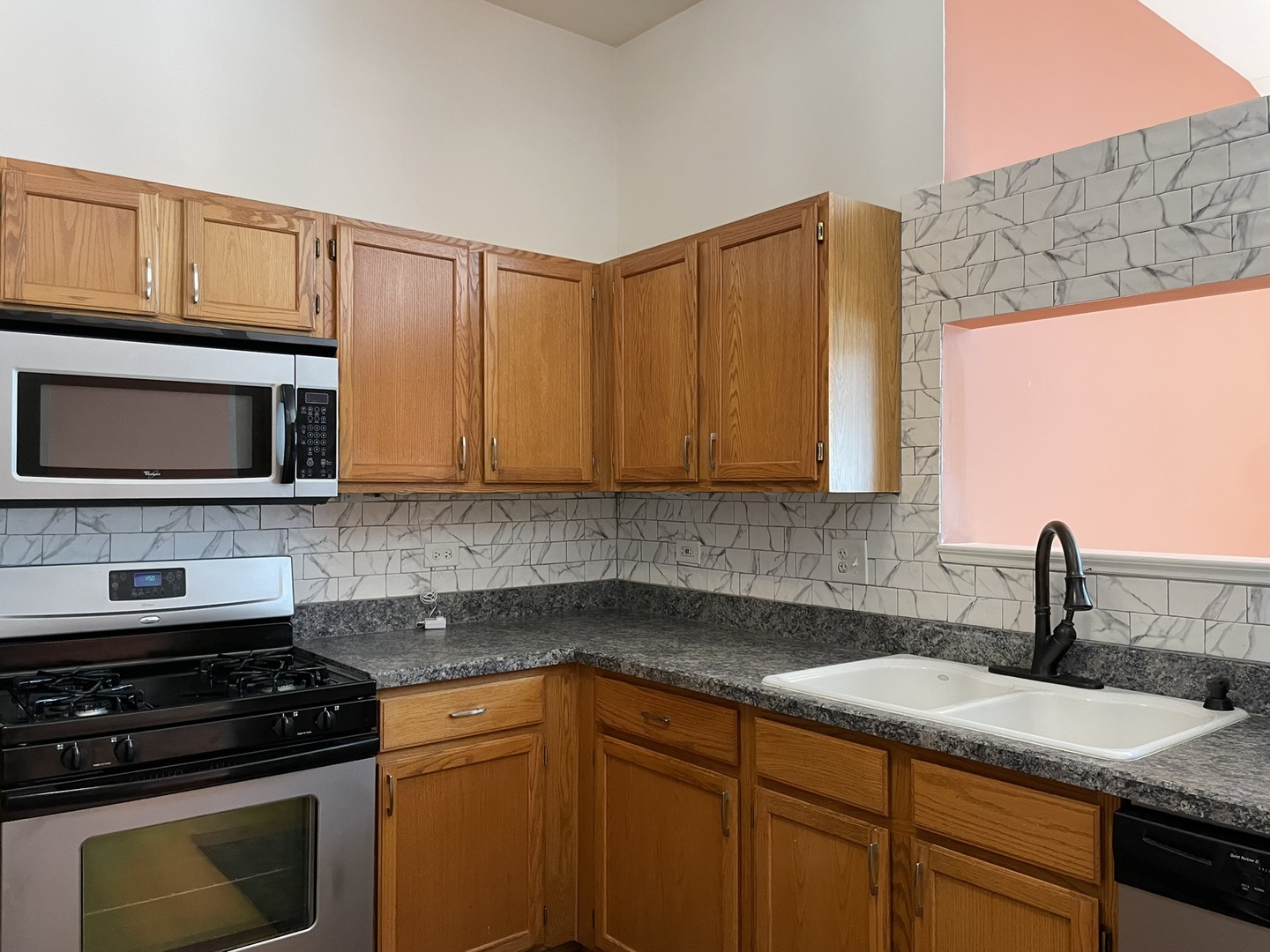 2043 Peach Tree Lane Algonquin, IL 60102 - Photo 6 of 19 a kitchen with granite countertop stainless steel appliances a stove sink and microwave