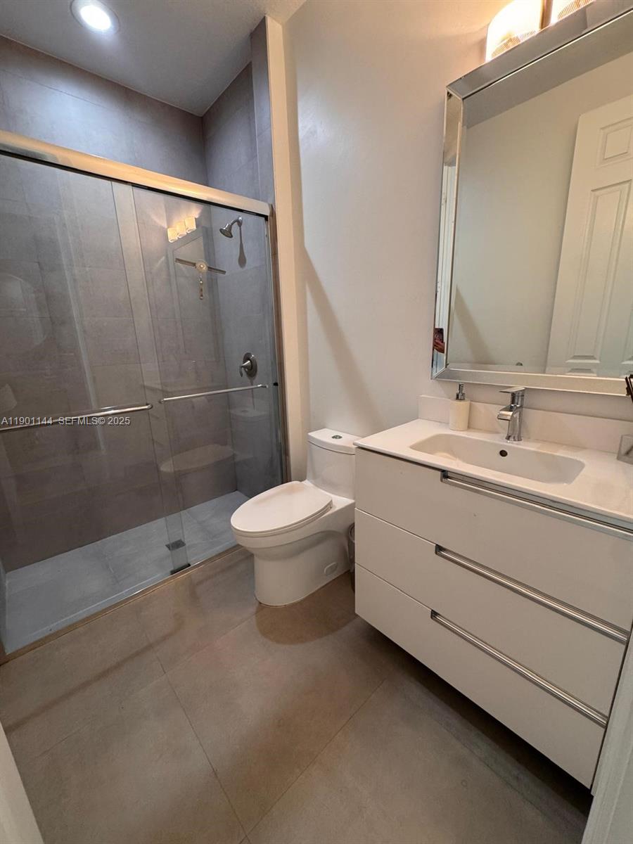 8850 Northwest 98th Court Doral, FL 33178 - Photo 24 of 26 a bathroom with a sink a toilet and shower
