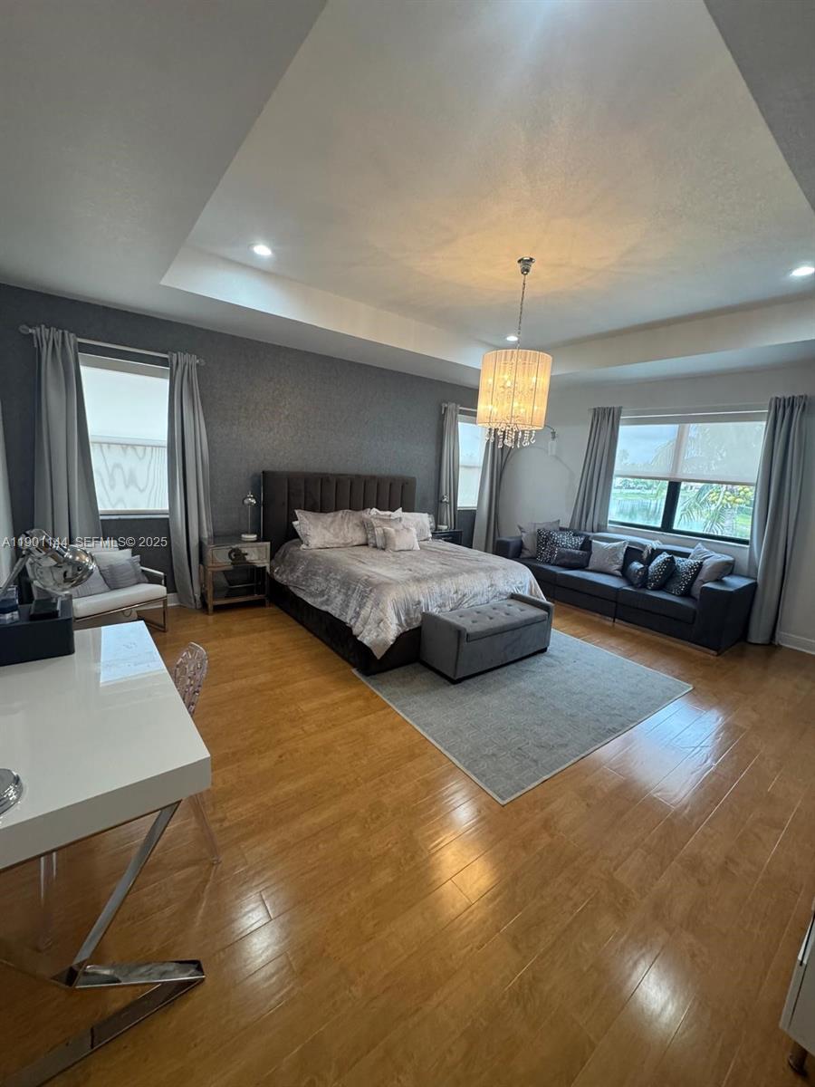 8850 Northwest 98th Court Doral, FL 33178 - Photo 25 of 26 a bedroom with a bed window and table