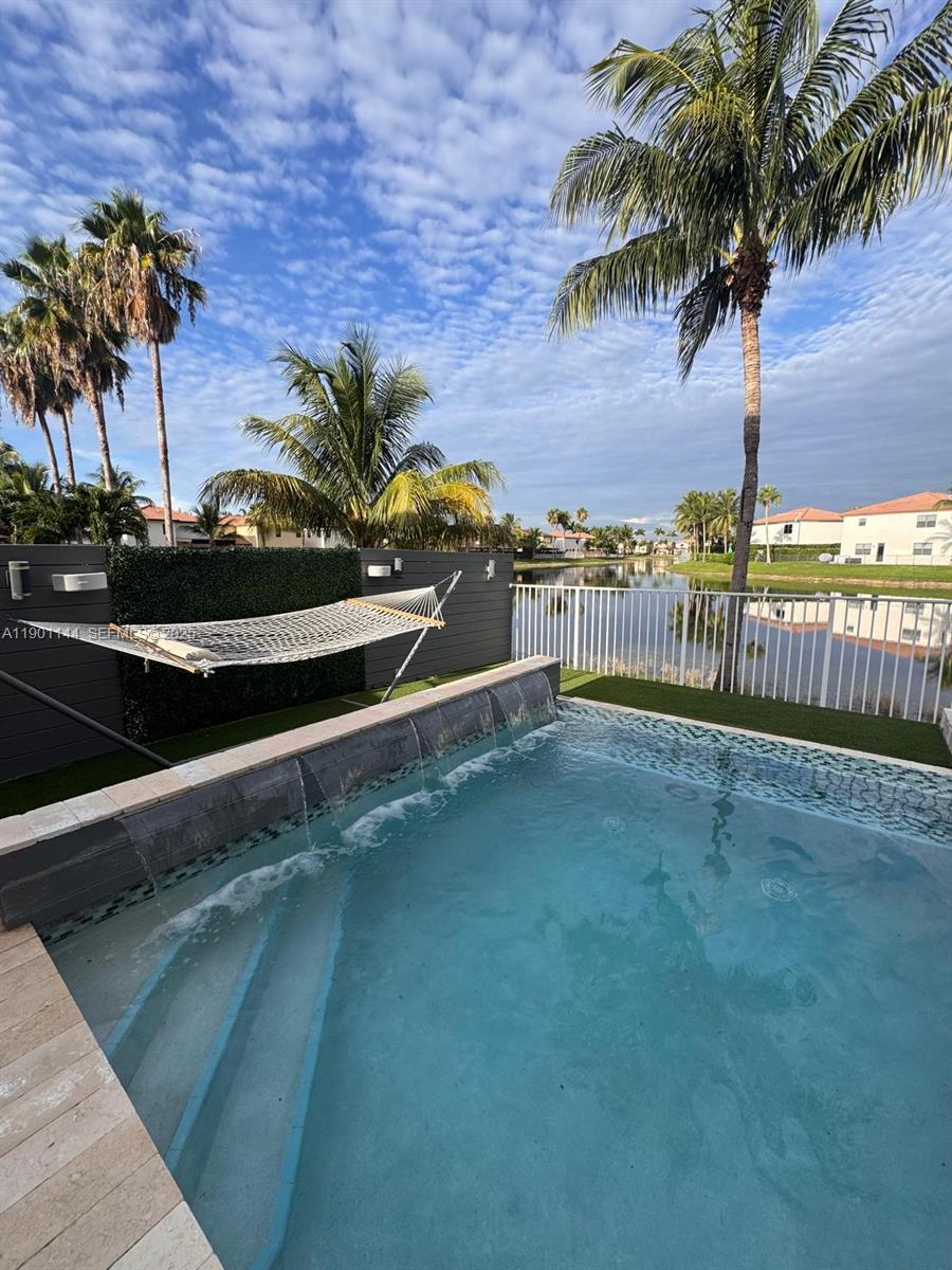 8850 Northwest 98th Court Doral, FL 33178 - Photo 5 of 26 a view of a balcony with a potted plants
