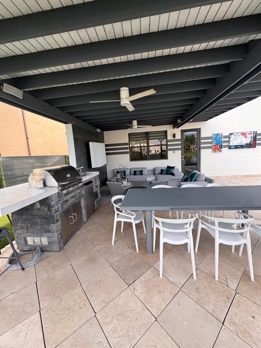 8850 Northwest 98th Court Doral, FL 33178 - Photo 8 of 26 a view of a chairs and tables in the back yard