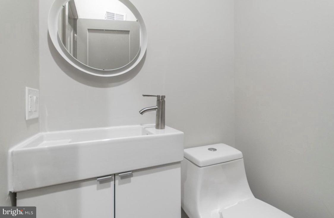 3339 Ridge Avenue Philadelphia, PA 19132 - Photo 13 of 33 a bathroom with a sink and a toilet