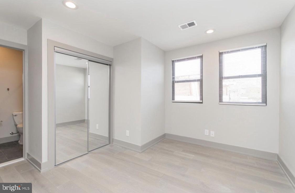 3339 Ridge Avenue Philadelphia, PA 19132 - Photo 22 of 33 an empty room with windows and closet