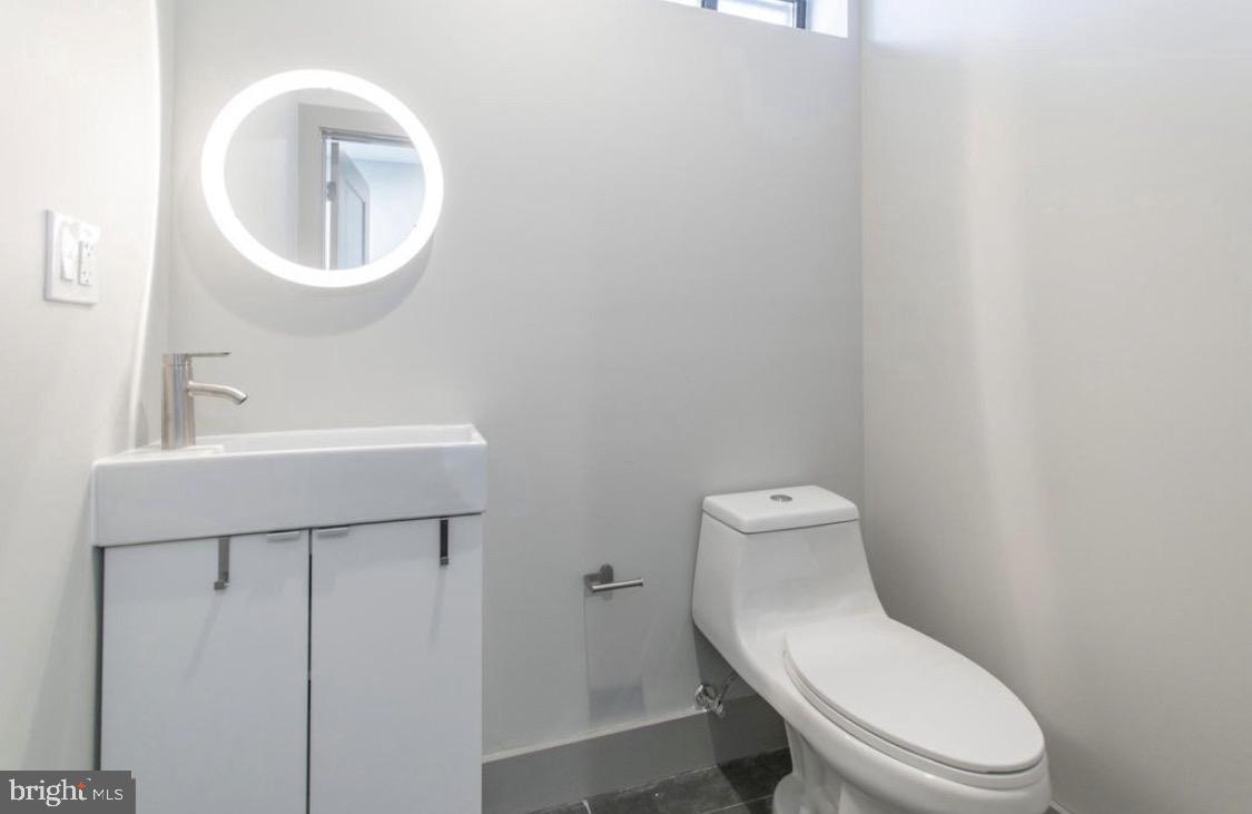 3339 Ridge Avenue Philadelphia, PA 19132 - Photo 27 of 33 a white toilet sitting next to a bathroom sink