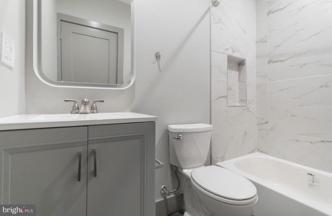 3339 Ridge Avenue Philadelphia, PA 19132 - Photo 29 of 33 a bathroom with a sink toilet and shower
