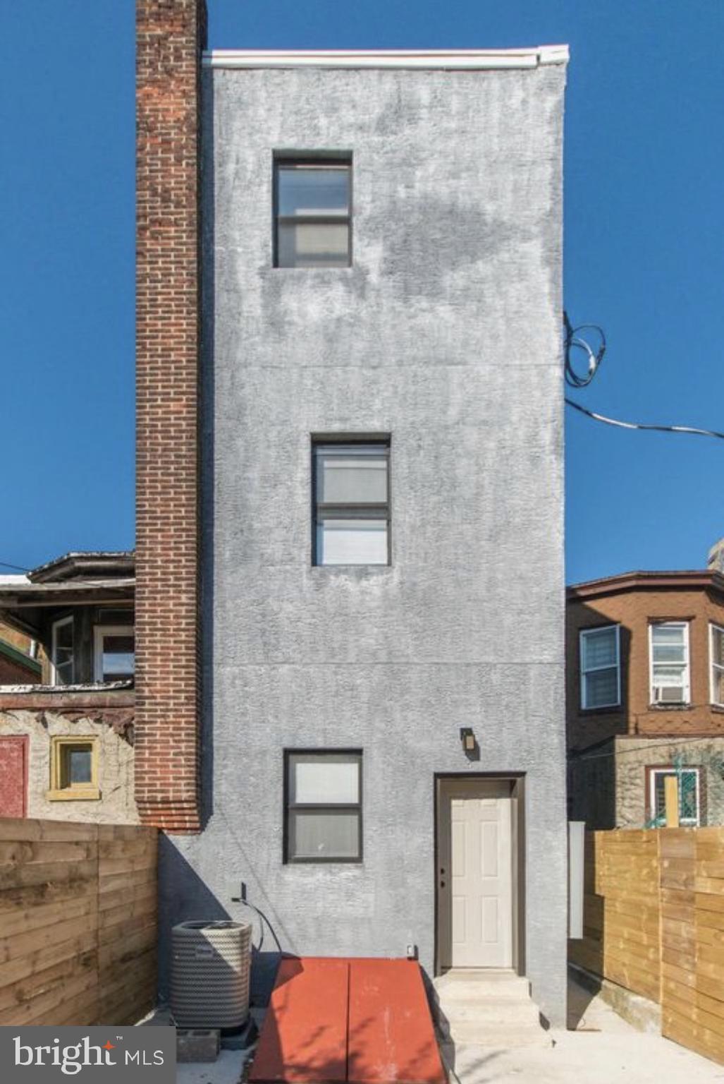 3339 Ridge Avenue Philadelphia, PA 19132 - Photo 32 of 33 a brick building with a bench and a shower