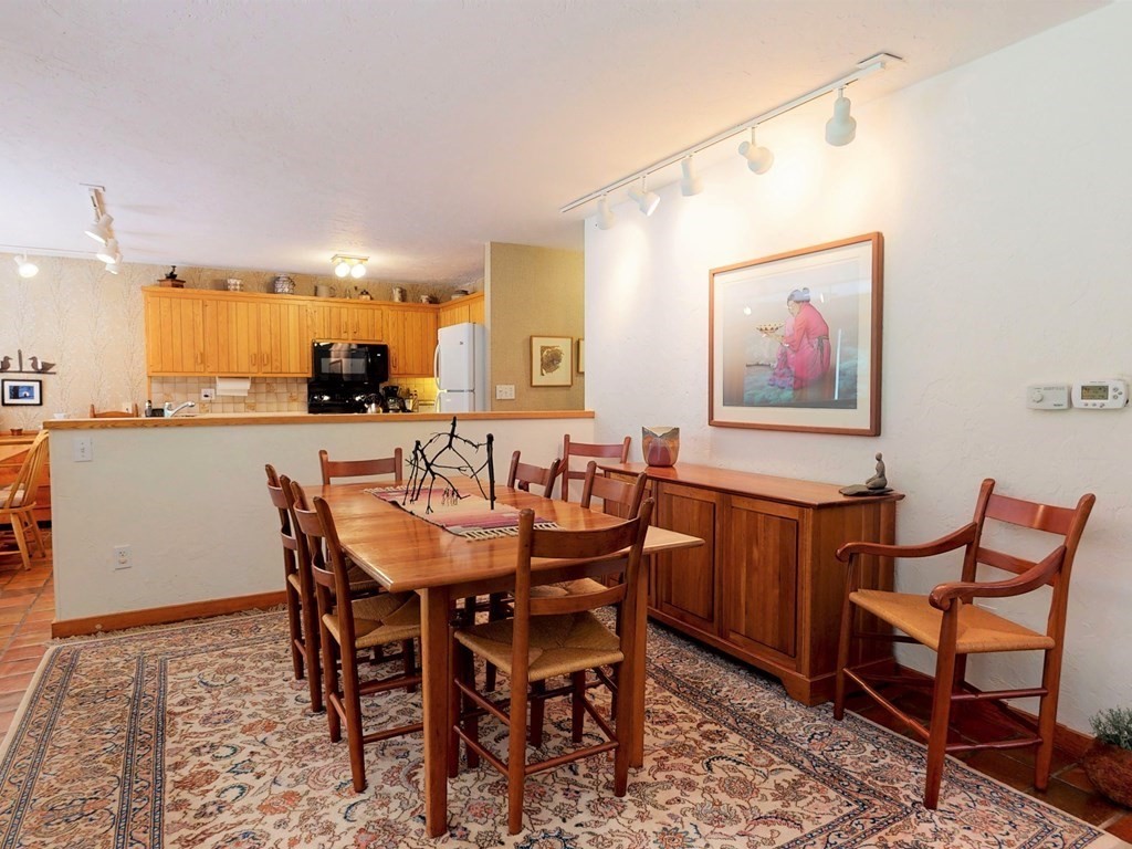 19 Lambert Road Belmont, MA 02478 - Photo 14 of 42 a dining room with furniture and a floor to ceiling window