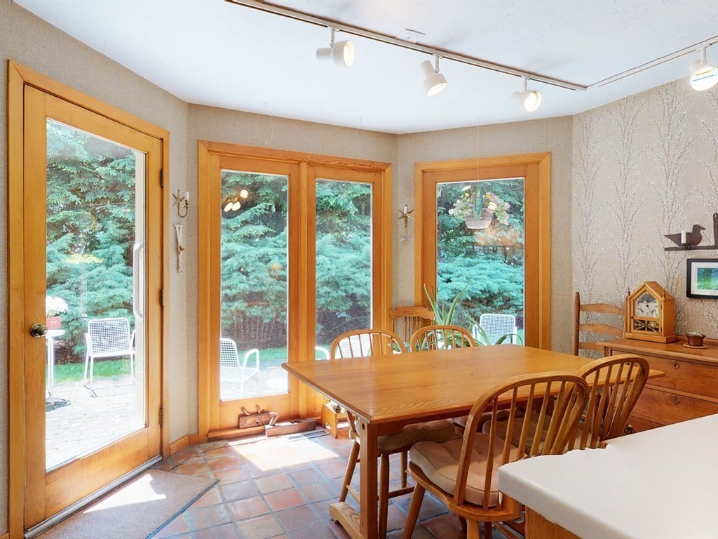 19 Lambert Road Belmont, MA 02478 - Photo 15 of 42 a dining room with furniture a chandelier and wooden floor