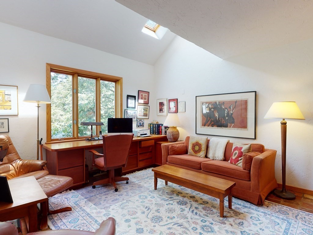 19 Lambert Road Belmont, MA 02478 - Photo 19 of 42 a living room with furniture and a lamp