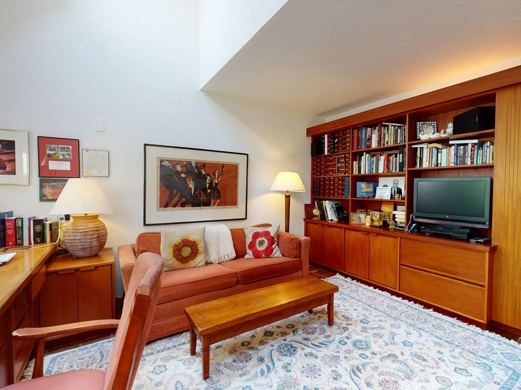 19 Lambert Road Belmont, MA 02478 - Photo 20 of 42 a living room with furniture and a flat screen tv