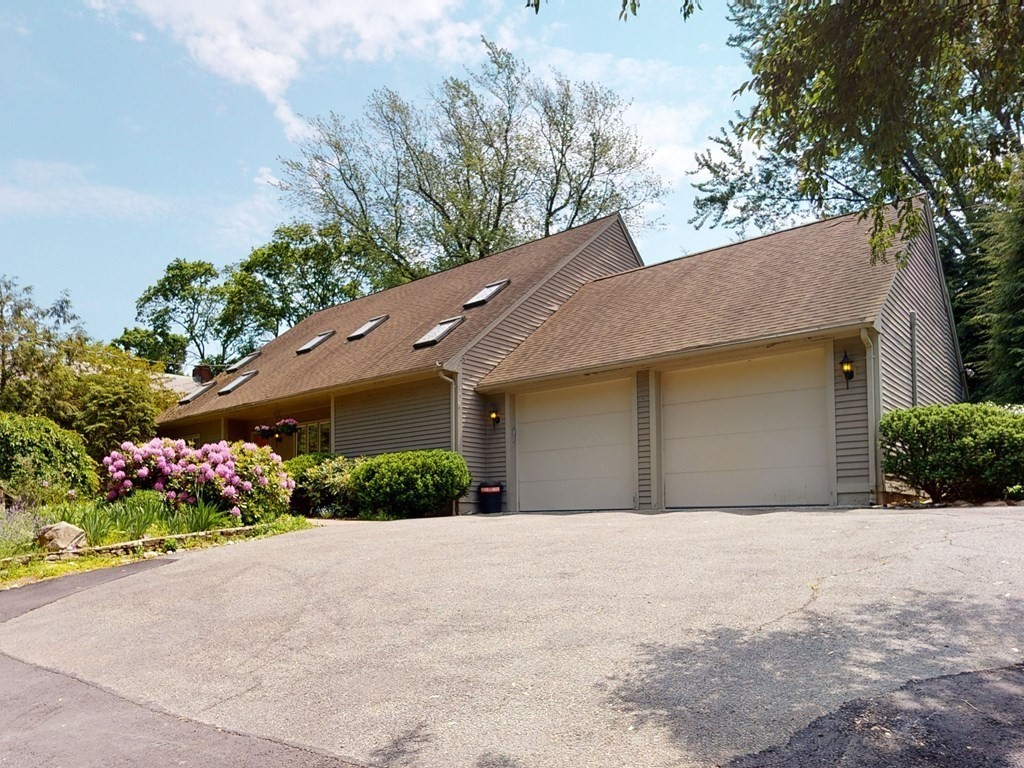 19 Lambert Road Belmont, MA 02478 - Photo 2 of 42 a front view of a house with a yard and garage