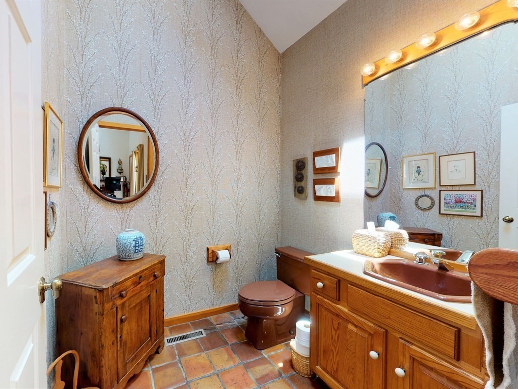 19 Lambert Road Belmont, MA 02478 - Photo 21 of 42 a bathroom with a toilet a sink and a mirror