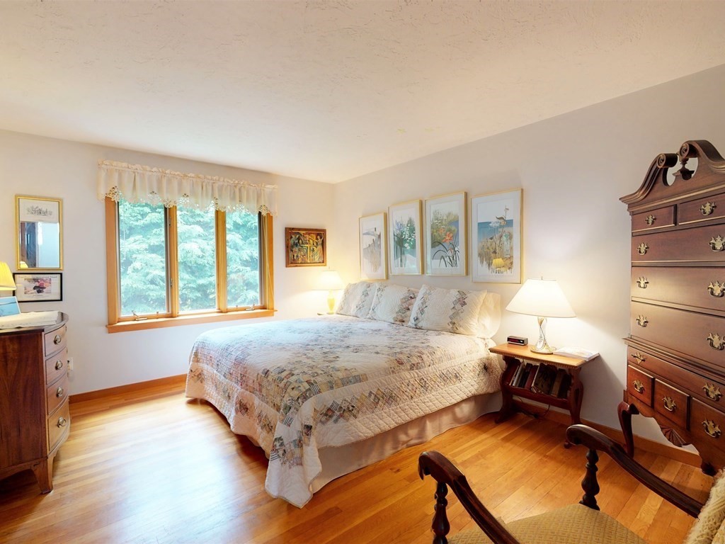 19 Lambert Road Belmont, MA 02478 - Photo 24 of 42 a bedroom with a bed and wooden floor
