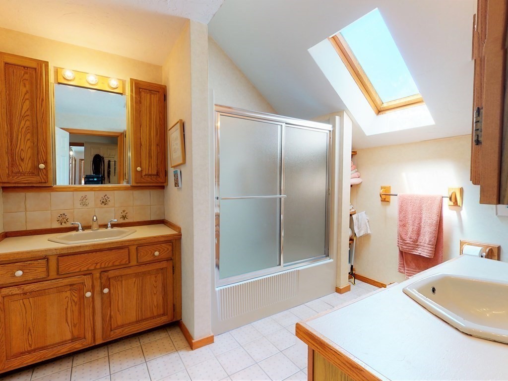 19 Lambert Road Belmont, MA 02478 - Photo 27 of 42 a bathroom with a sink a toilet and mirror