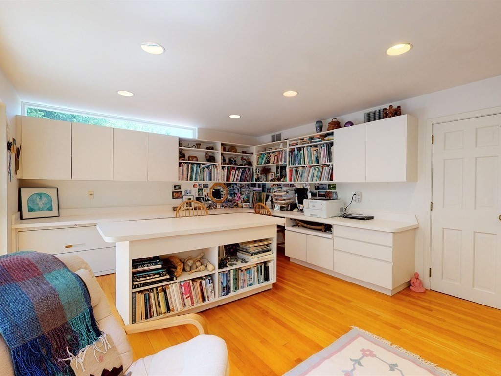 19 Lambert Road Belmont, MA 02478 - Photo 33 of 42 a large white kitchen with stainless steel appliances granite countertop a stove and a refrigerator with white cabinets