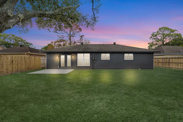 a view of a swimming pool with a yard