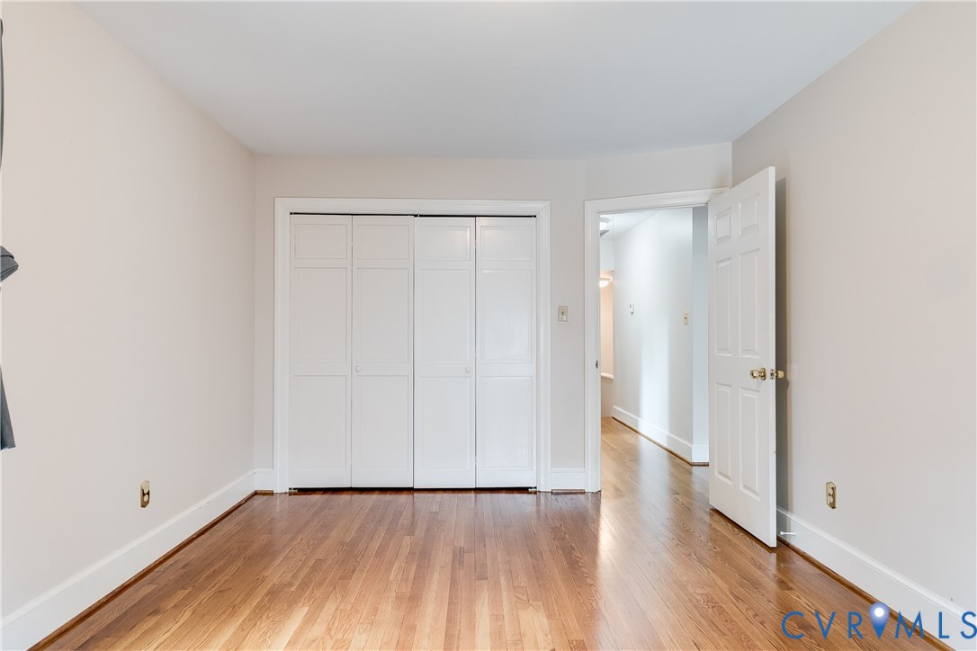 3924 Belspring Road Chester, VA 23831 - Photo 26 of 36 Hardwood flooring throughout, featuring a bi-fold