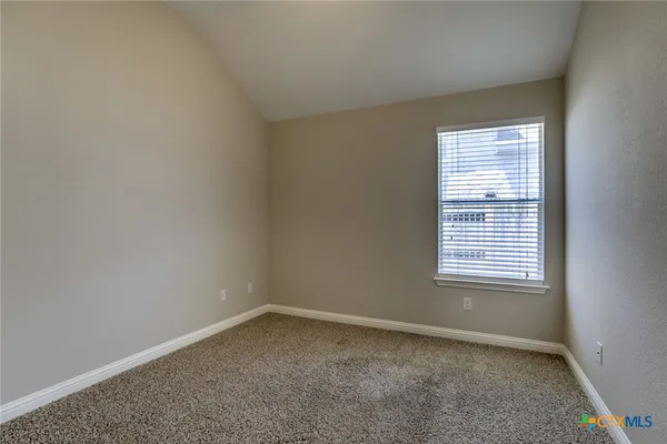 a front view of a house with a yard and porch