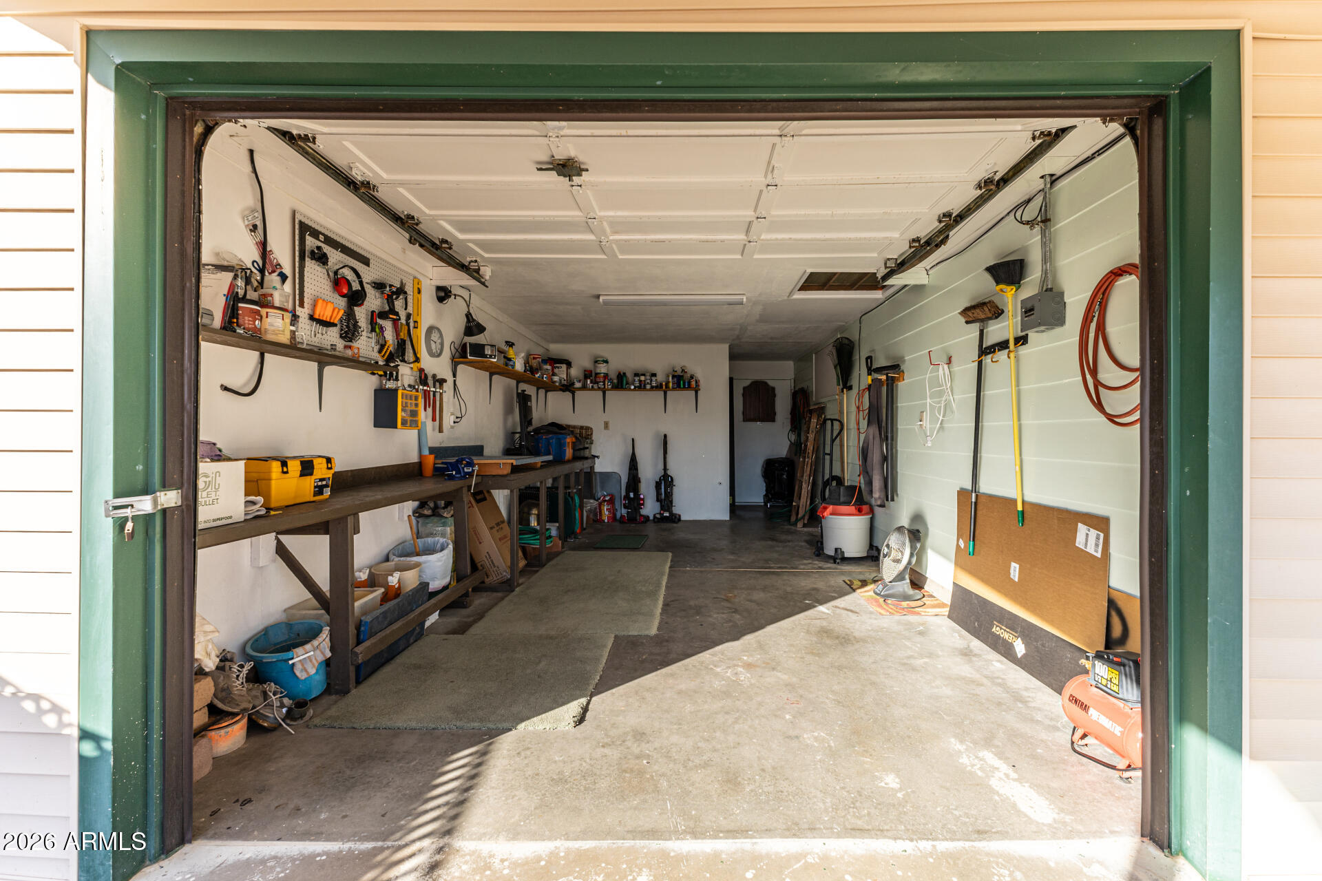 700 North Victory Drive Apache Junction, AZ 85120 - Photo 17 of 28 a view of a hallway with wooden floors and couches