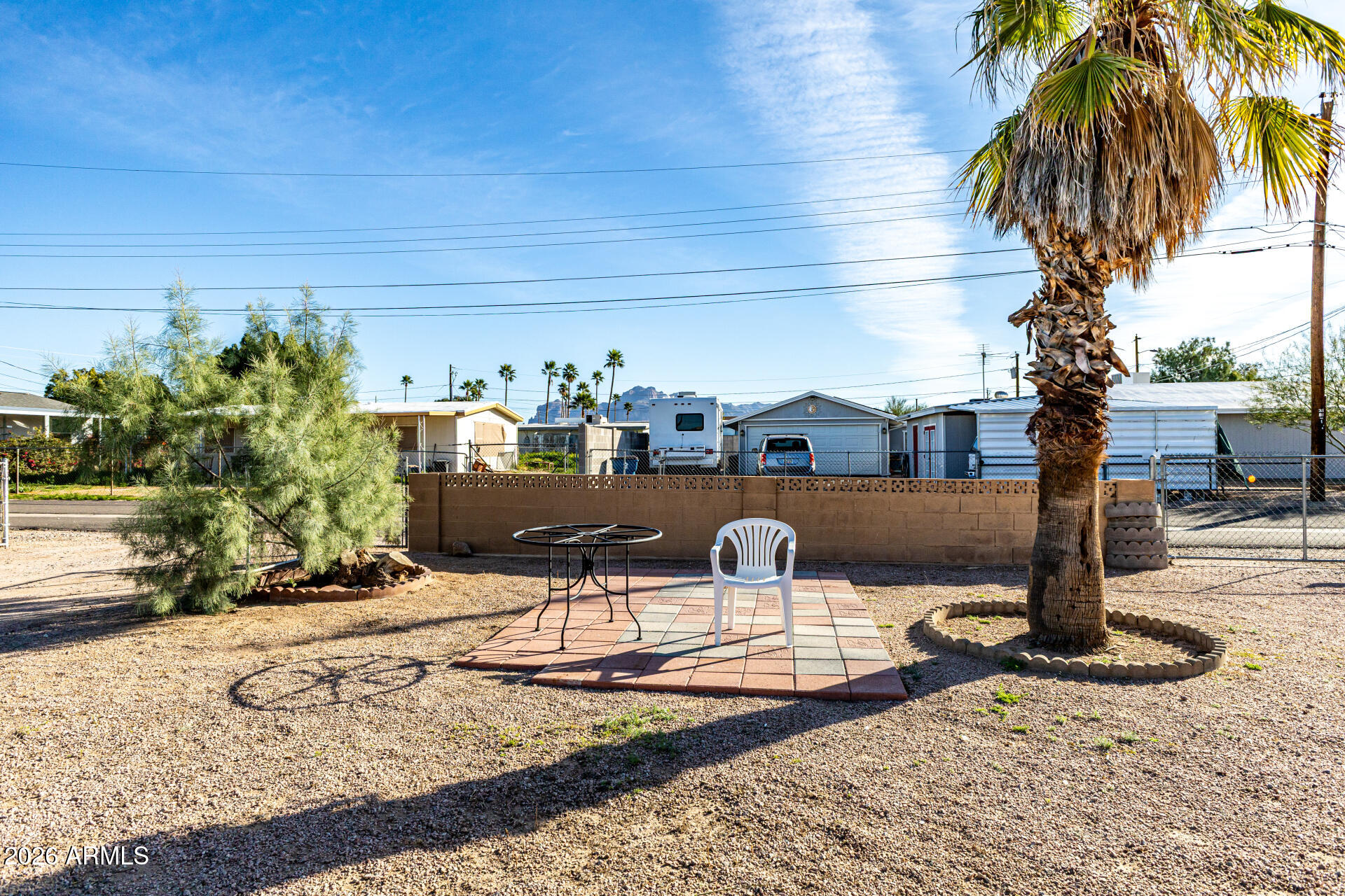 700 North Victory Drive Apache Junction, AZ 85120 - Photo 21 of 28 a front view of a house with garden and patio