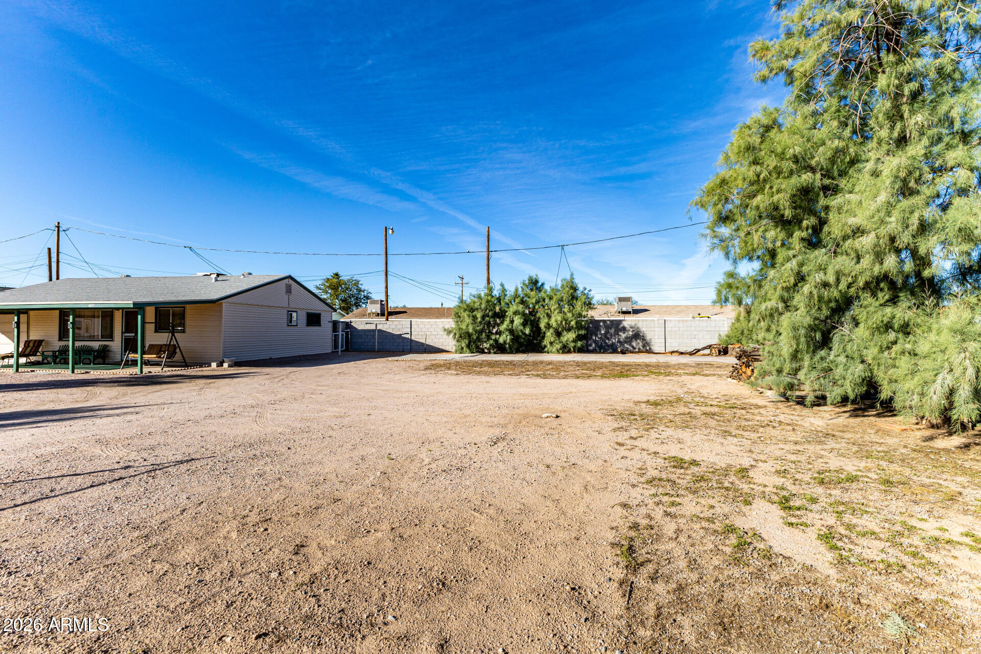 700 North Victory Drive Apache Junction, AZ 85120 - Photo 23 of 28 a view of a house with a yard and potted plants