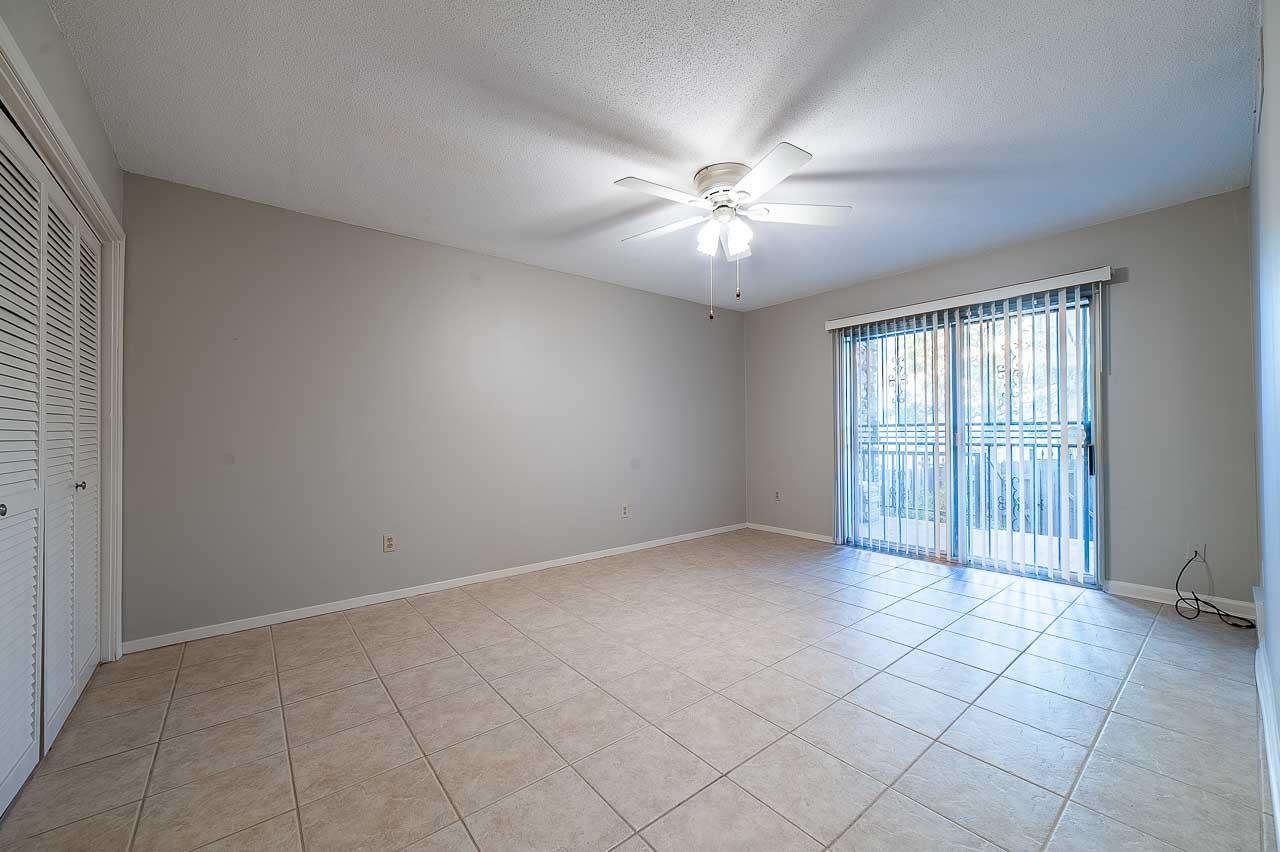 409 South Perkins Road, Unit 3 Memphis, TN 38117 - Photo 10 of 23 This is the second bedroom with doors going out to the patio and direct access to the bathroom.
