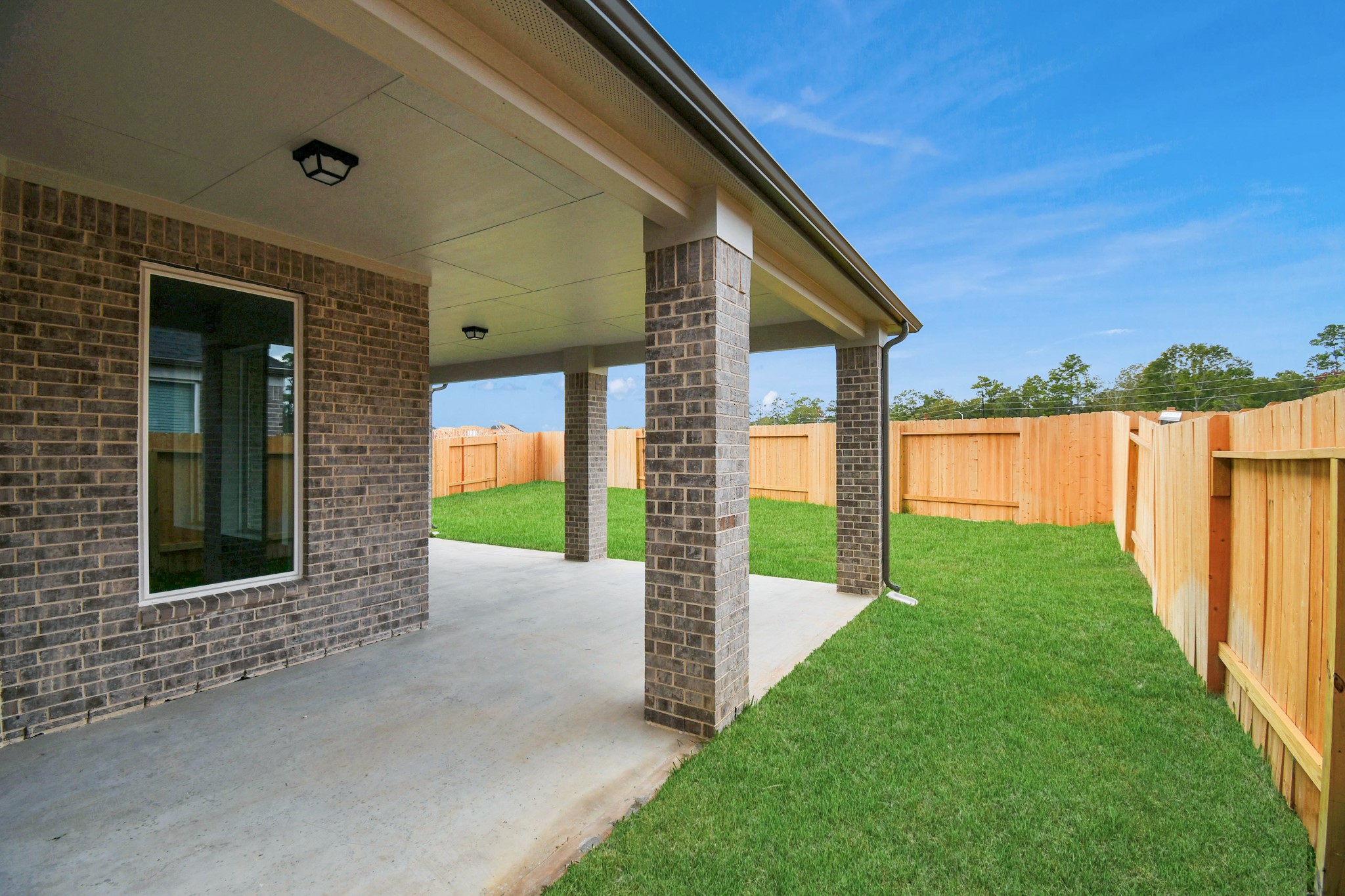 3043 Native Spg Drive Spring, TX 77373 - Photo 38 of 39 Experience outdoor living at its finest on this expansive covered patio, thoughtfully designed for BBQs and delightful outdoor dining. Sample photo of completed home with similar floor plan. Actual colors and selections may vary.