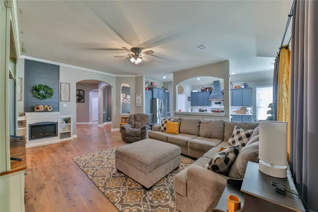 a living room with furniture and a fireplace