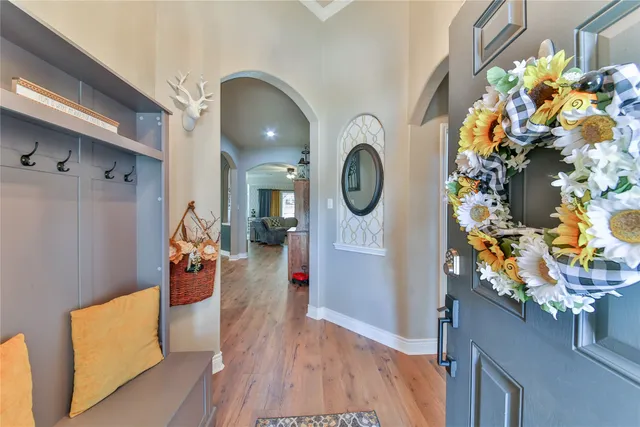 a view of living room with furniture and a fireplace