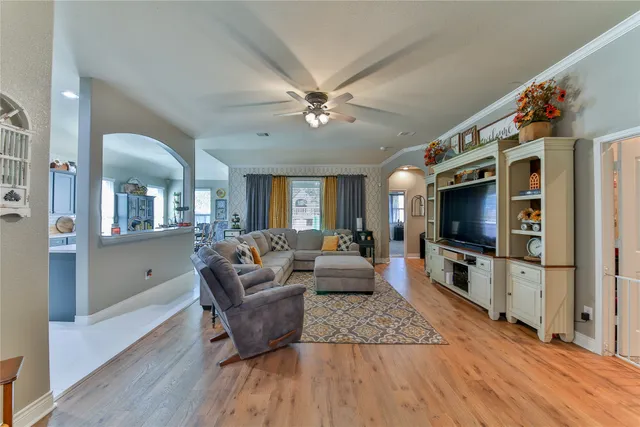 a living room with furniture and a flat screen tv