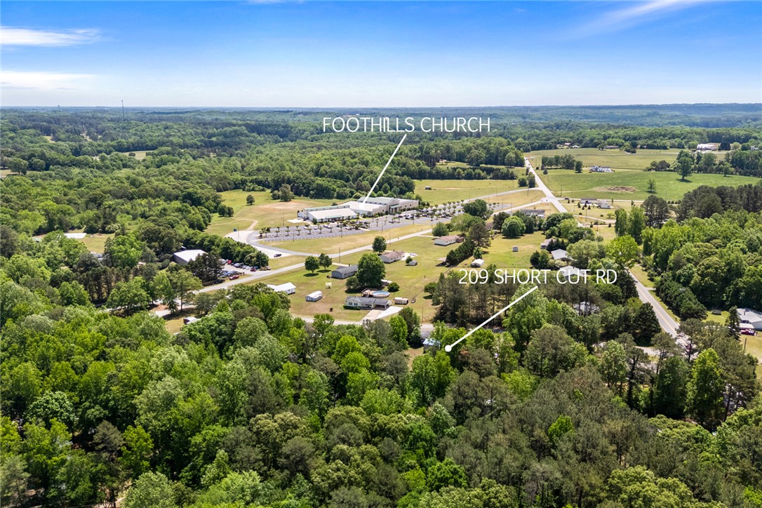 209 Short Cut Road Westminster, SC 29693 - Photo 13 of 27 Vast green landscapes under a clear sky offer a serene environment for your next property.