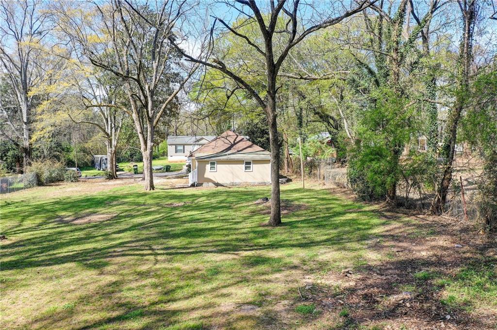 411 Ash Street Monroe, GA 30655 - Photo 13 of 36 a view of a house with a yard