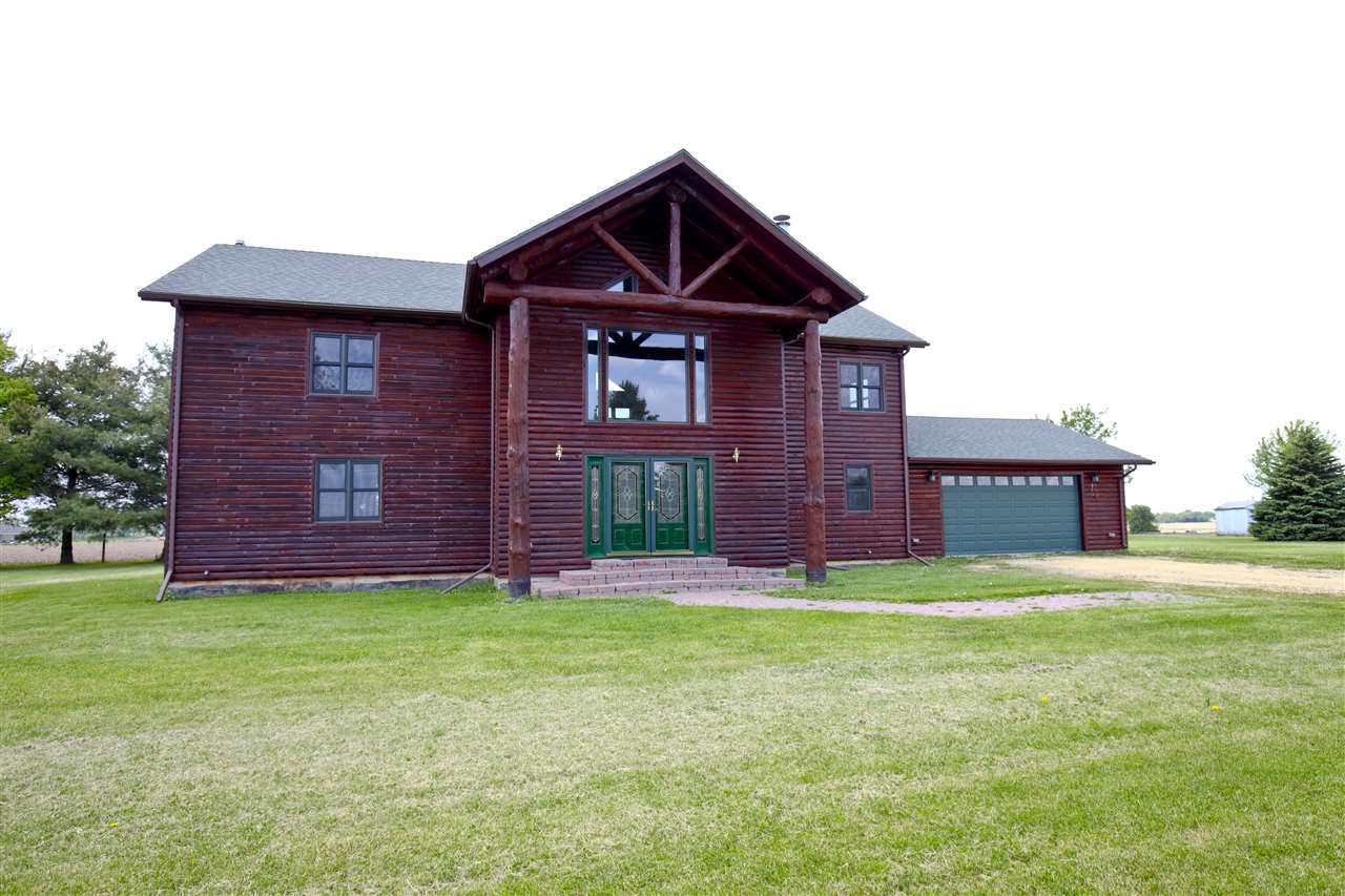 20100 Grade School Road Caledonia, IL 61011 - Photo 19 of 21 a view of a brick house with a yard