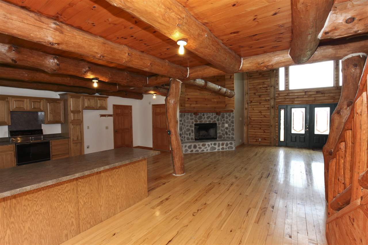20100 Grade School Road Caledonia, IL 61011 - Photo 4 of 21 a view of a livingroom with a fireplace