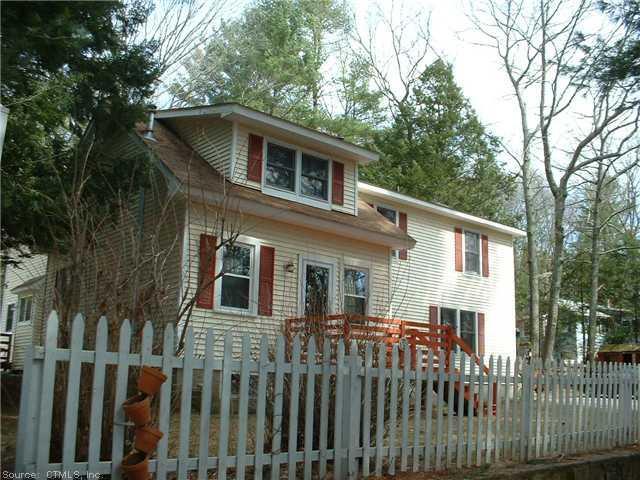 237 Brick Top Road Windham, CT 06280 - Photo 1 of 1 a front view of a house with a garden